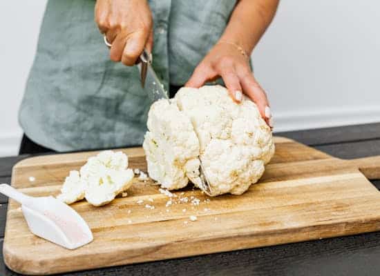 Person Slicing White Cauliflower