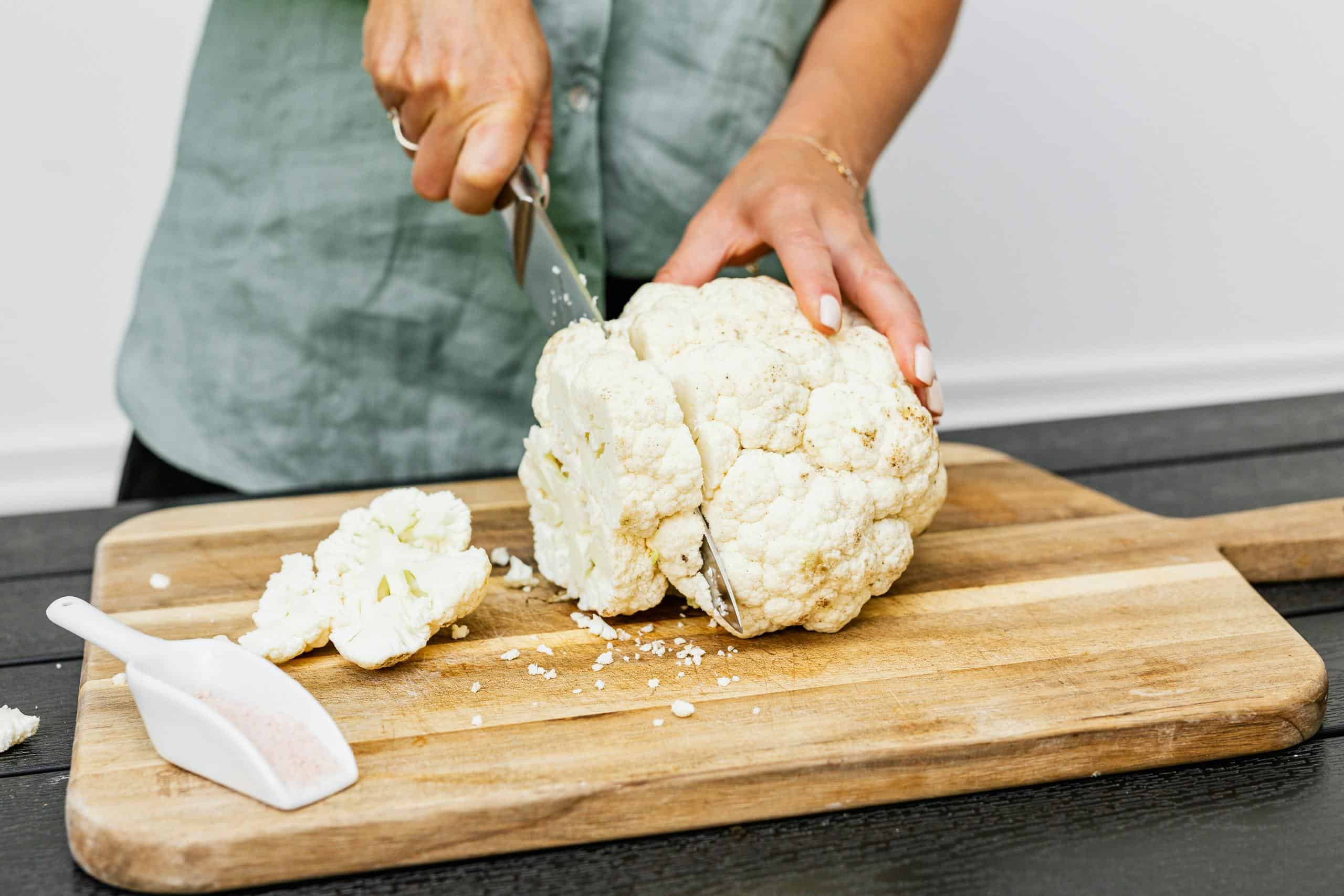Person Slicing White Cauliflower